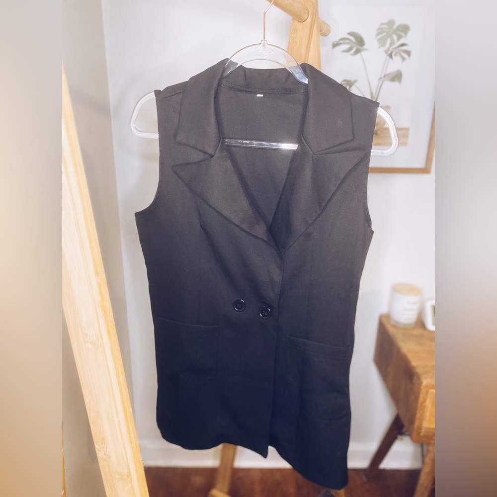 Sleeveless business vest, black, can wear open or closed.